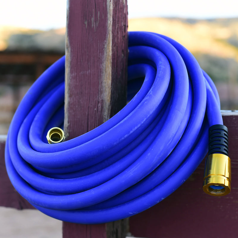 A blue hose wrapped around a fence post