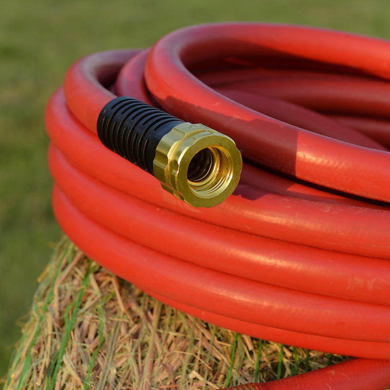Close up on the end of a red hose