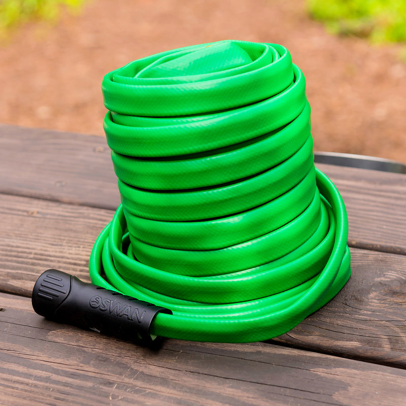 A coiled up green hose