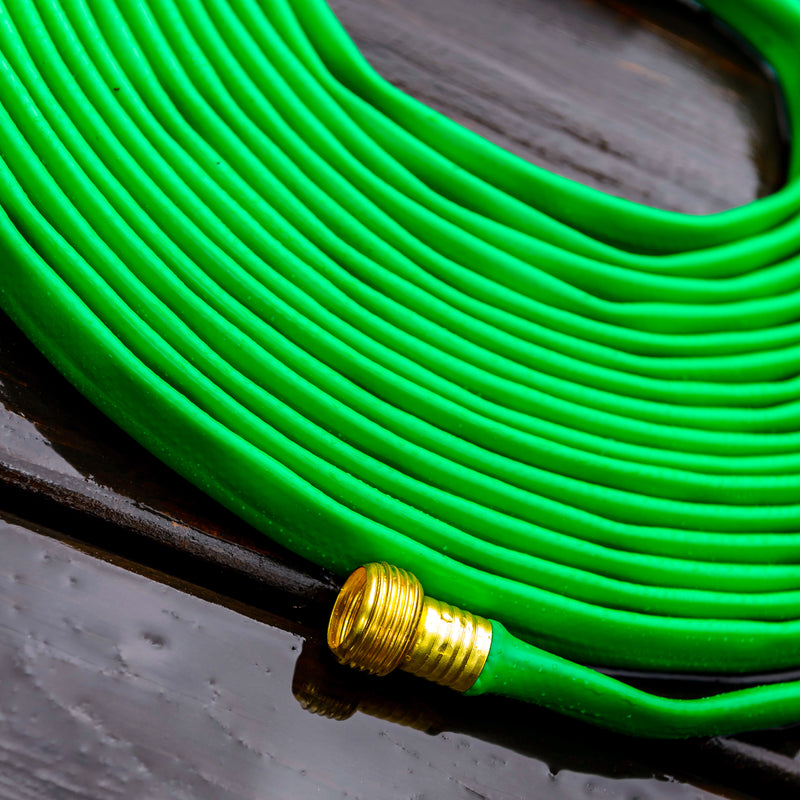 Coiled up green hose showing connector