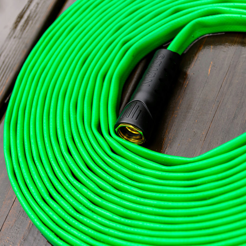 Coiled up green hose showing black connector