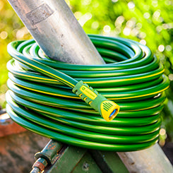 Rain Barrel and Garden Hose: A Perfect Pair for Year-Round Watering