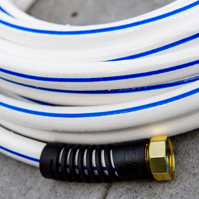 Close up on the end of a white and blue marine hose