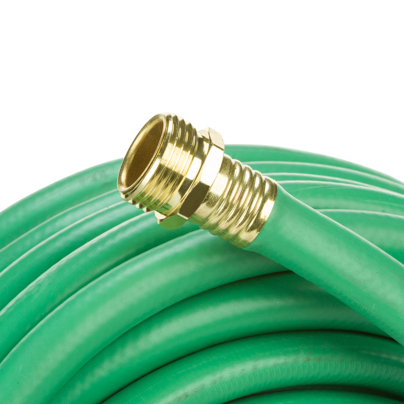 Coiled up green hose showing the male end