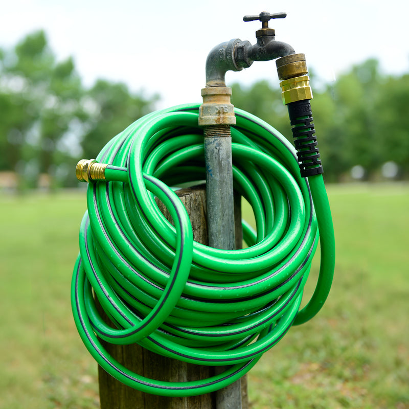 Close up on the end of the Element UltraLITE hose at an outdoor faucet