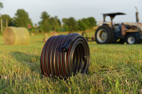 Viper High Performance Rubber hose 50ft coiled up on grass